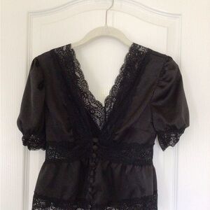 Womens black XS short sleeved lacy blouse.